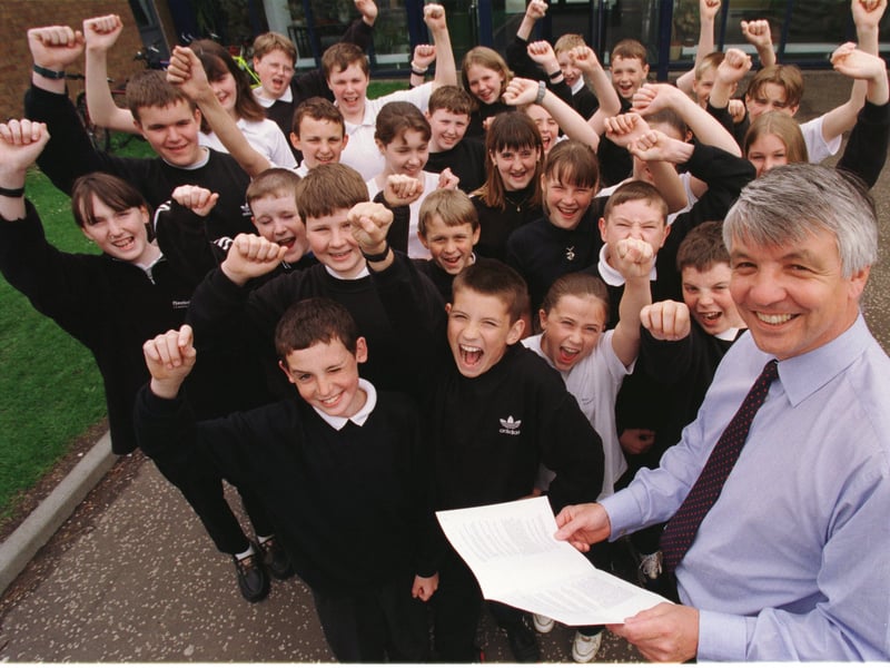 Headteacher John Low and 1st year pupils at Linlithgow Academy, West Lothian, celebrate a  Scottish Office report praising the school, in 1998