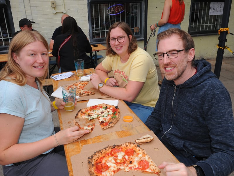 Gemma Cornish, Lucy Morrison and Wayne Cornish enjoying some pizzas.