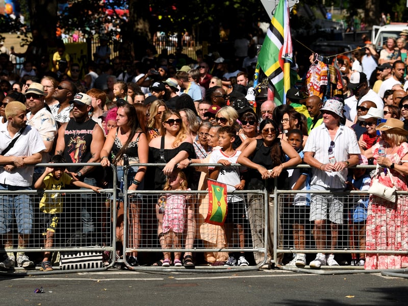 Crowds watch the carnival.