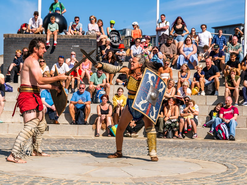 An re-enactment group entertaining the crowds in the outdoor amphitheatre.