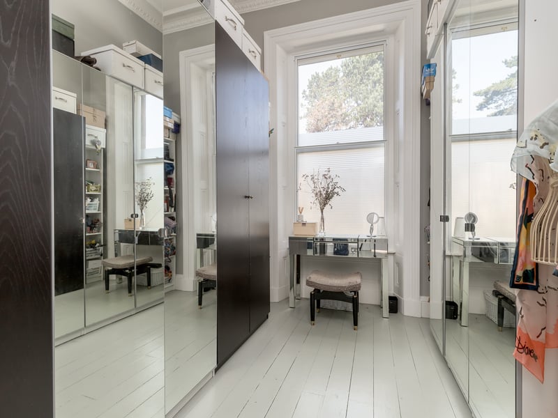 Currently being used as a dressing room, the third bedroom is also a good size with natural light. 