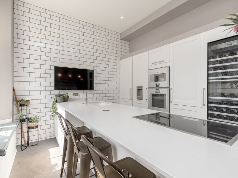 The home includes a large island with breakfast bar with premium appliances.