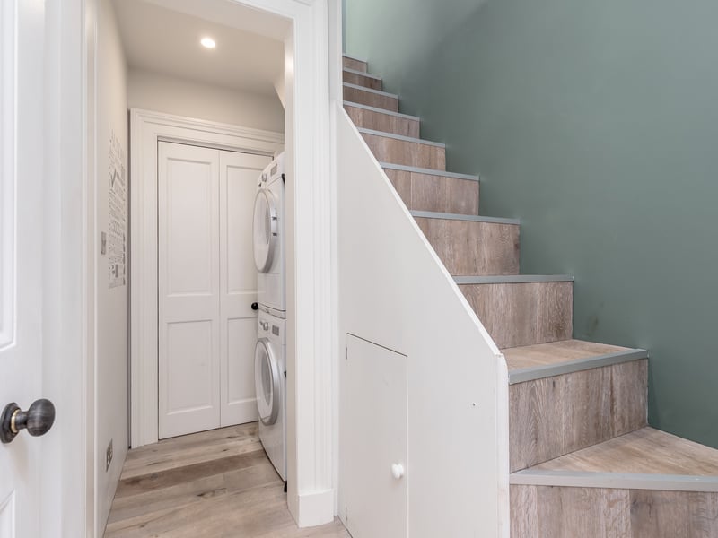 Upstairs there is also a utility room tucked off the hallway for convenience. 