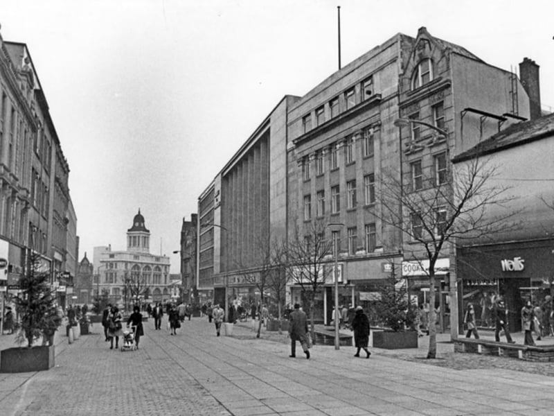 Shops on Fargate, Sheffield, in November 1974, including Wallis, ladies outfitters; Thomas Cook, travel agents; and Woodhouse Furnishers