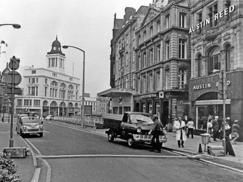 Shops at the bottom of Fargate, Sheffield city centre, in 1971, showing the men's outfitters Austin Reed, Barclays Bank, and Boots the Chemist