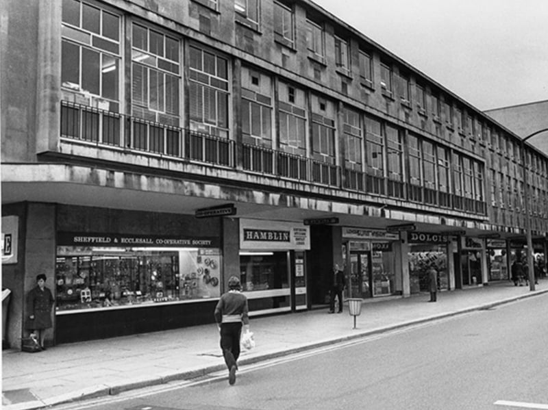 Shops on The Moor, Sheffield, in 1975, including Sheffield and Ecclesall Co-operative Society; Hamblin, contact lens centre; Sure Vision; Dolcis, shoe shop; and Etam, ladies' fashions