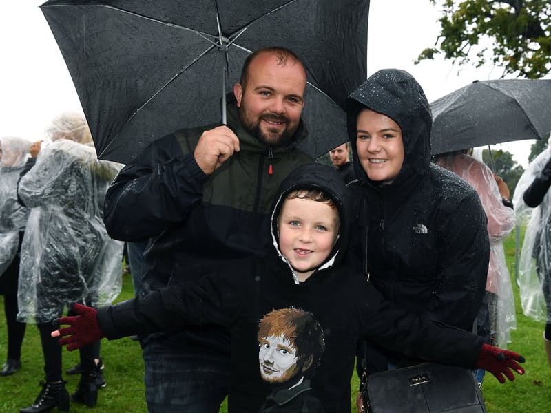 Fans queue in the rain for the Ed Sheeran concert at Roundhay Park, Leeds, on July 16, 2019