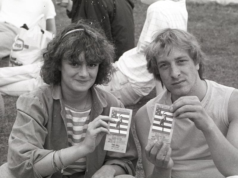 Fans display their tickets for the Bruce Springsteen concert at Leeds' Roundhay Park on July 7, 1985