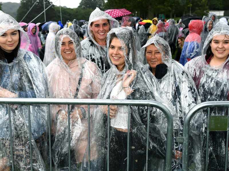Fans queue in the rain for the Ed Sheeran concert at Roundhay Park, Leeds, on July 16, 2019