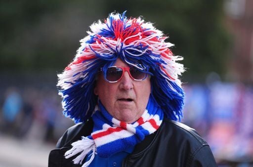 A Rangers fan outside the stadium before the game.