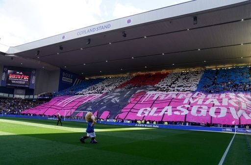 Rangers fans display a tifo and hold up coloured cards ahead of kick-off.