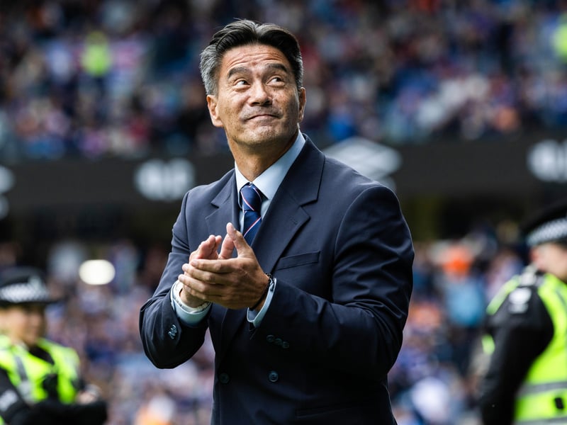Former Rangers goal scorer Michael Mols greets the fans at half-time.