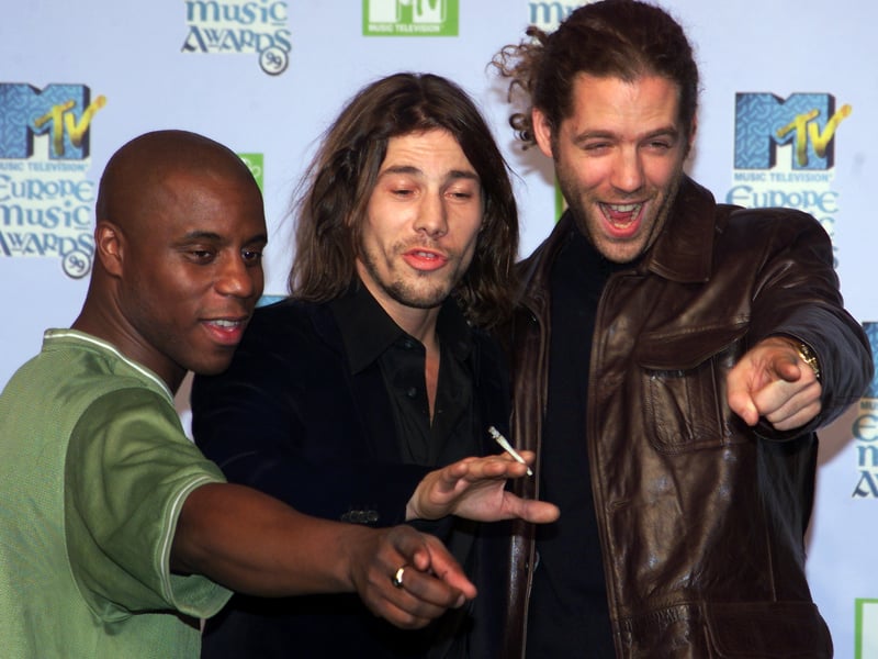 Jamiroquai pose for photographers during the 1999 MTV Europe Awards