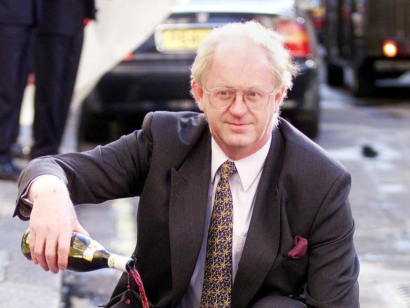 Ben Gill, president of the National Union of Farmers, pours Beaujolais Nouveau down the drain in November 1999, in protest over the British beef ban