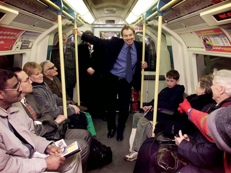 Prime Minister Tony Blair travels on the newly built Jubilee Line extension on the London Underground, to the Millennium Dome, in December 1999