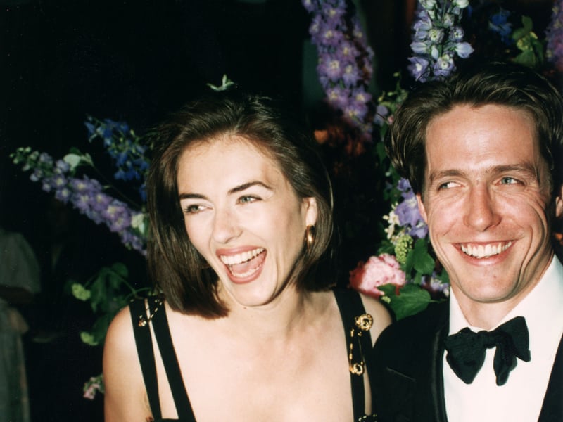 Hugh Grant and his girlfriend Elizabeth Hurley attend the post-premiere party of his latest film, Four Weddings and a Funeral, in May 1994