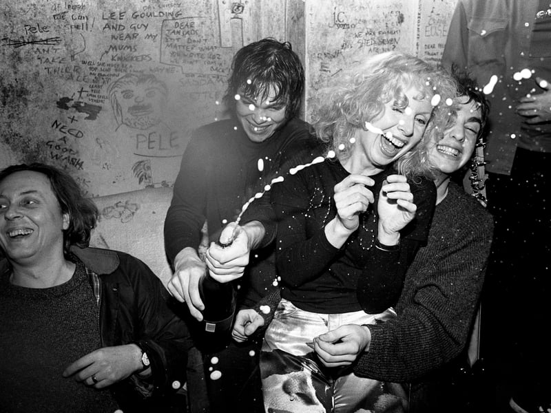 Supergrass backstage in 1995, with their manager Chris Hufford, who also managed Radiohead