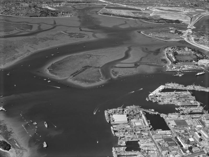 Portsmouth Harbour, Hampshire, in 1974, looking across the harbour and naval dockyards towards Portchester