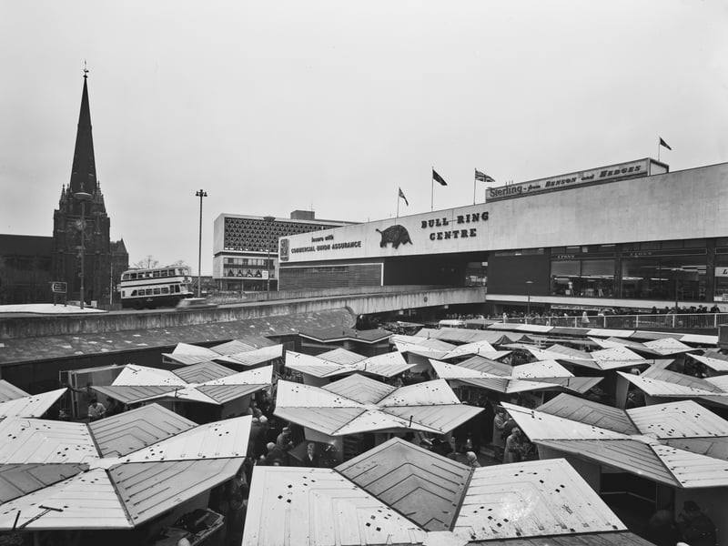 Looking down over the market stalls of the Bull Ring Open Market, outside the Bull Ring shopping centre in Birmingham, in April 1971