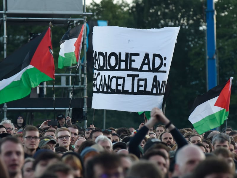 Protestors in the crowd urged the band to cancel their upcoming gig in Tel Aviv.
