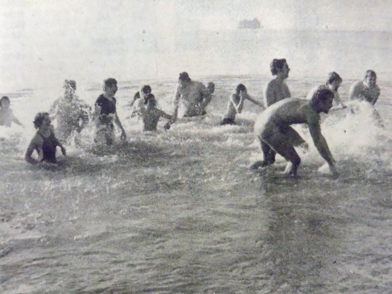 Members of Portsmouth Voluntary Lifeguards take part in their Christmas Day dip at Southsea, where the temperature was 7C