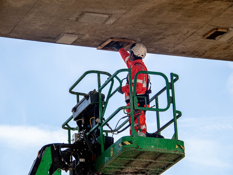 Repair work underway on the underside of the bridge.