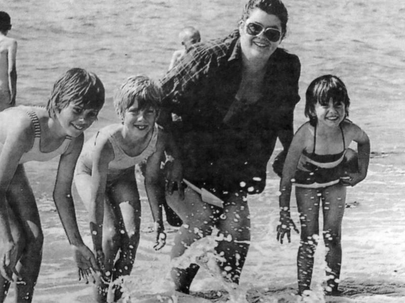 Pictured paddling at Southsea beach during the heatwave are Debbie Thorne with children Claire, 11, Vanessa, eight, and Sandra, five