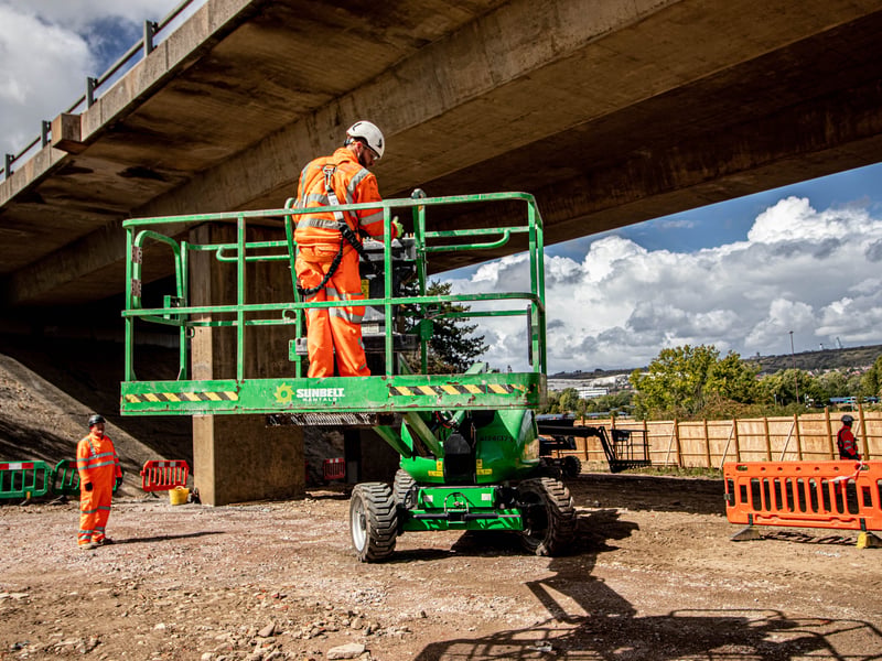 A worker heads up to complete repairs.