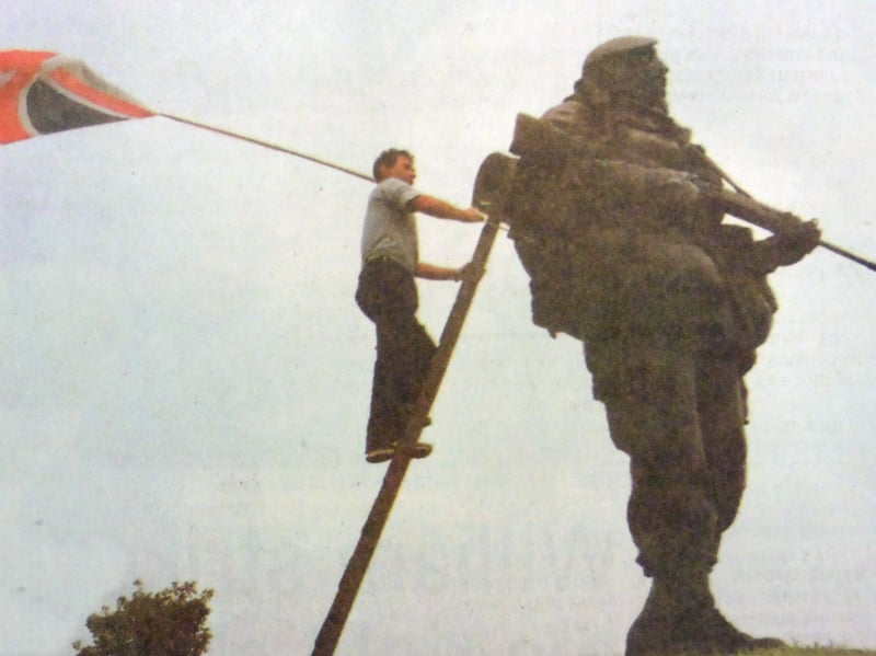 Southsea's strong sea breezes had succeeded where even a Falklands minefield failed. The statue of the Yompey at the entrance to the Royal Marines Museum, Eastney, had been gazing out to sea minus his distinctive Union flag. Passers by were worried it had been stolen before they saw it was wrapped in an aerial of the 13ft figure's field radio. Pictured on duty, unfurling the flag, is Vic Hayles.