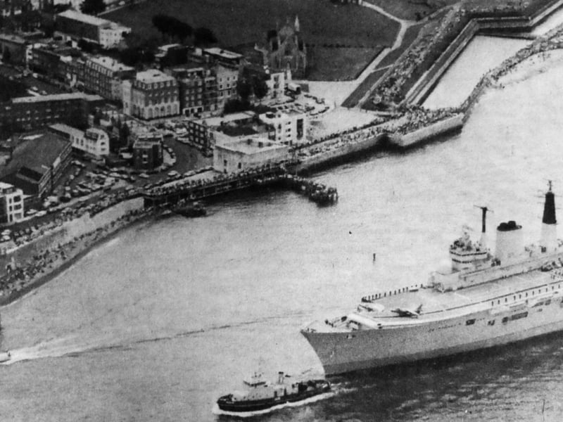 The HMS Ark Royal sails into Portsmouth Harbour, with thousands of spectators lining the quayside and esplanade at Southsea. The Round Tower at Old Portsmouth was packed with eager photographers who wanted to catch a glimpse of the new ship, which had begun her journey home from the Swan Hunter shipyard on Tyneside.