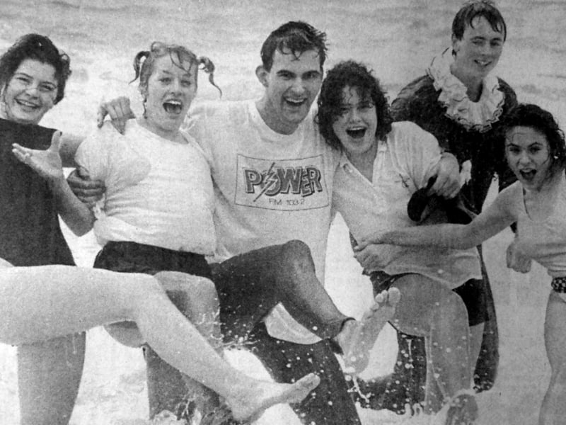 Charity dippers from Ocean Sound take part in a Christmas Day splash. More than 50 listeners joined disc jockey Pete Wardman for the Power FM swim at Southsea seafront.