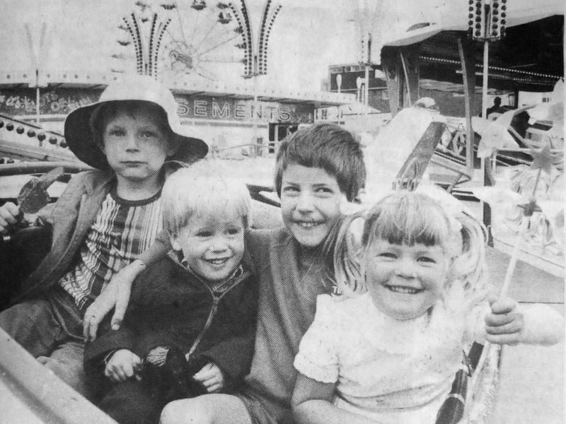 Thousands of task force families crowded into Southsea funfair at Clarence Pier to take advantage of the free rides for military families. Pictured flying their own planes at Southsea funfair are Colin James, aged seven, on the left, and his sister Kelly, four, right, whose father was serving in HMS Glamorgan. Centre right is Anthony Jones, two, whose father was serving in HMS Fearless. Centre left is Anthony's friend for the day, five-year-old Adrian Frearson. 