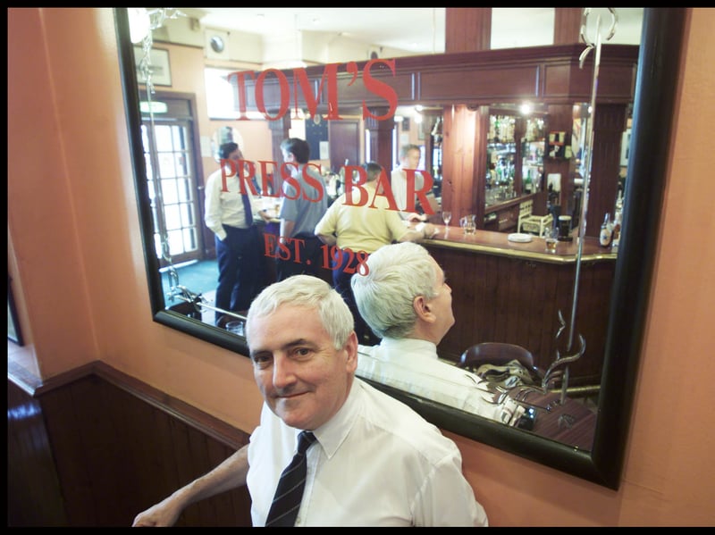 Desmond McEntee, host of the Press Bar, Albion Street, Glasgow, known as Tom's, in 2000. Desmond's father began the business in 1928.