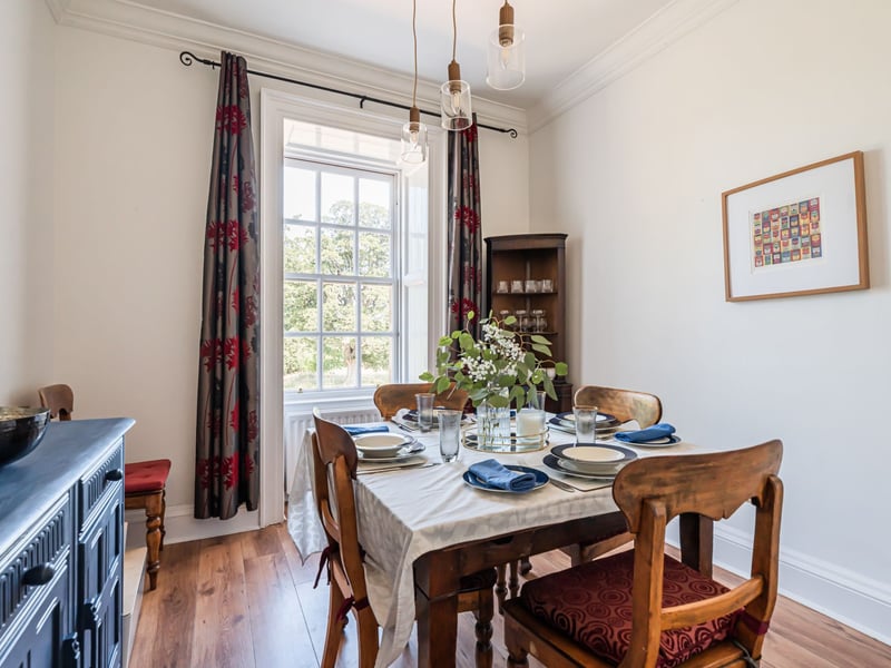 The sizeable dining room offers an ideal setting for family gatherings and entertaining, while also providing versatility to serve equally well as a generous double bedroom.