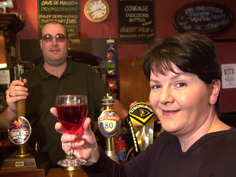 Paul Kinnoch, landlord of The Tyneside Tavern, toasts with his wife outside the pub to the franchising deal accomplished with Newcastle breweries in 2001