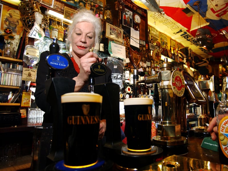 Mary Moriarty, landlady of the Port O' Leith pub in Edinburgh, pictured pulling a pint in 2002