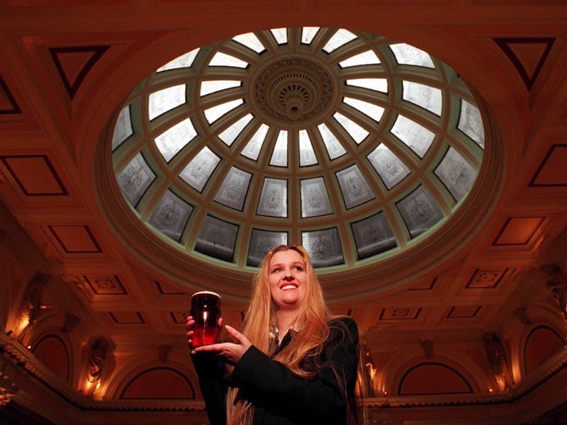 Andrea Annett, licensee and landlady of The Counting House pub, in the former Bank of Scotland, on George Square, Glasgow, in 1996