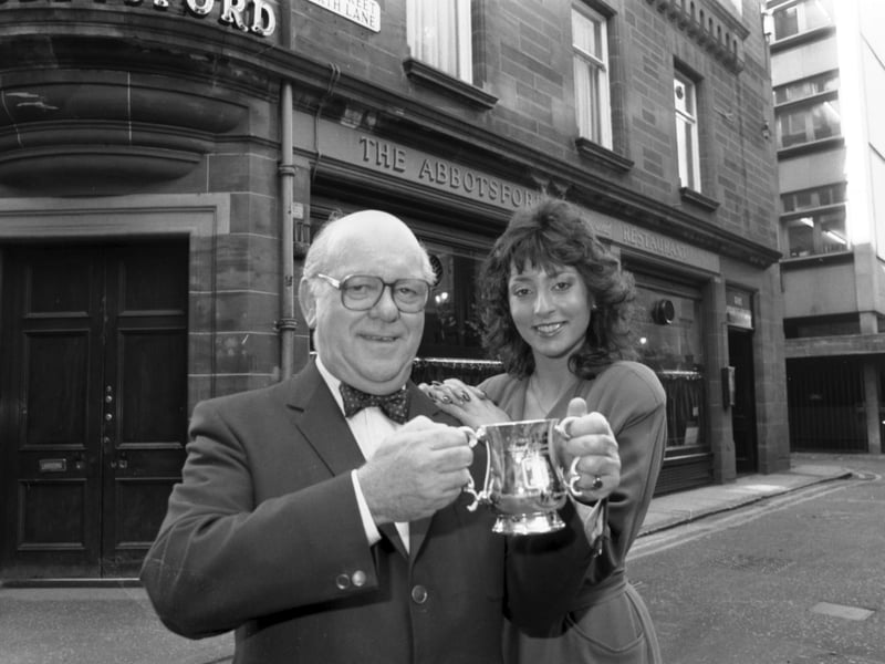 Landlord Jack Grant receives a tankard from Miss Edinburgh, June Lake, in October 1985, after his Rose Street bar, The Abbotsford, was voted one of the top 40 pubs in the world
