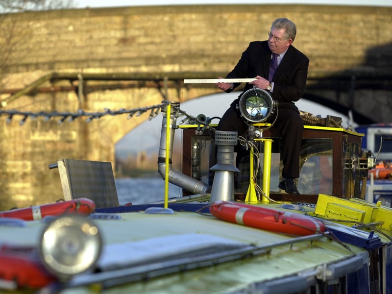 Ronnie Rusack, landlord of the Brige Inn at Ratho, pictured on his boat that wouldn't fit under the new bridge at Wester Hailes, in 2002