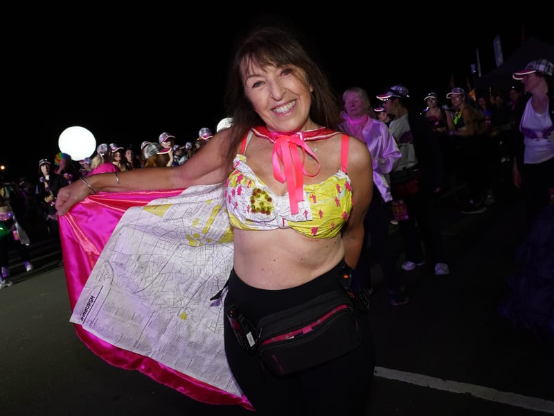 Walk the Walk founder and Chief Executive, Nina Barough CBE, wearing a decorated bra signed by The Proclaimers