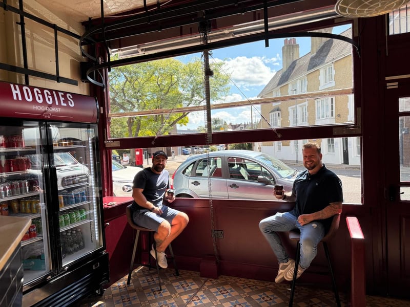 Left to right: Mark and Lewis, owners of Hoggies, enjoying a cup of Hoggies own-branded coffee in the newly installed open-window. 
