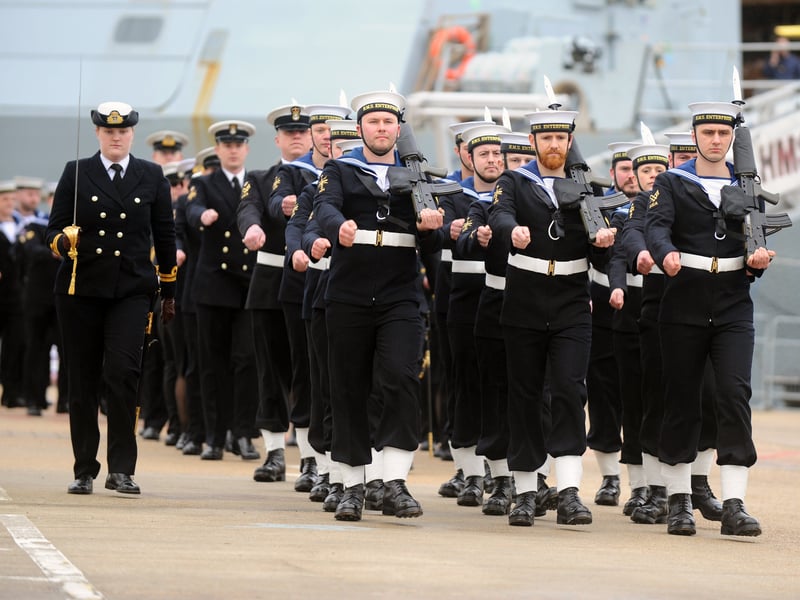 Sailors marching in formation at the HMS Enterprise decommissioning ceremony at HMNB Portsmouth on March 30, 2023.