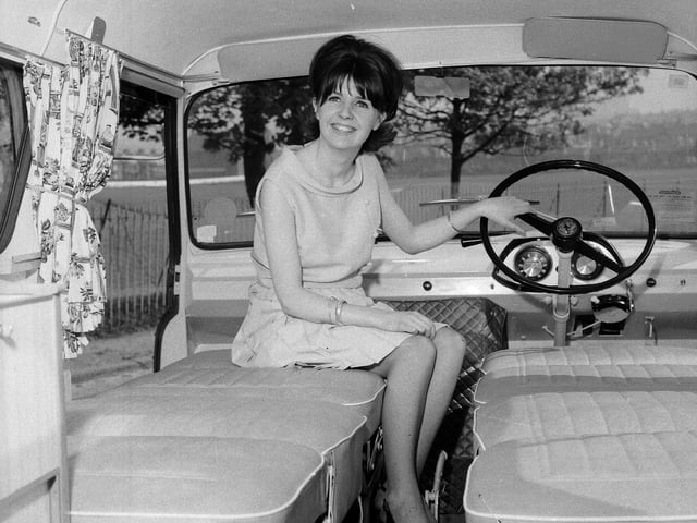 A woman sitting inside a brand new Dormobile caravan in 1965.