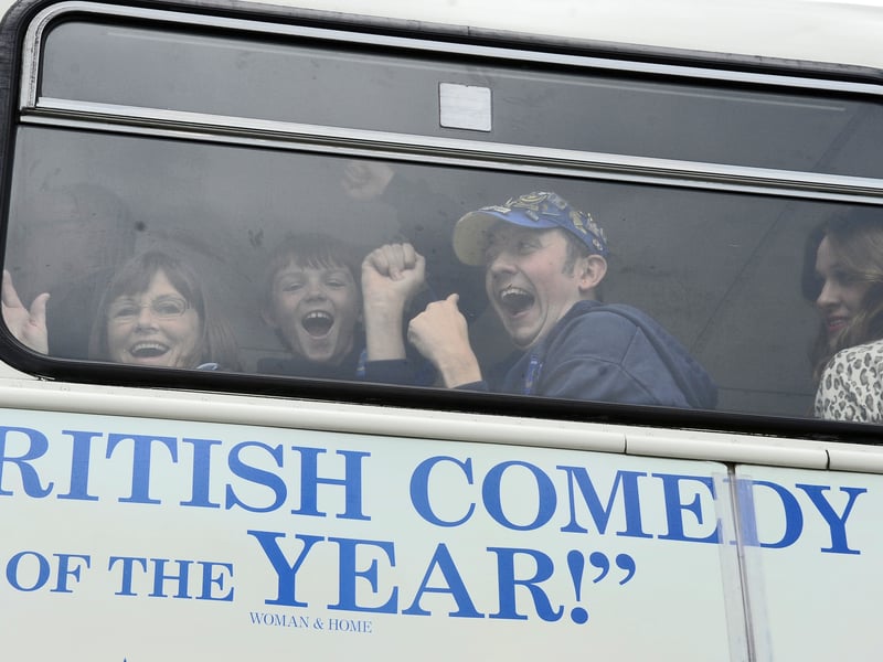Jubilant Pompey fans on the coach leaving the game.