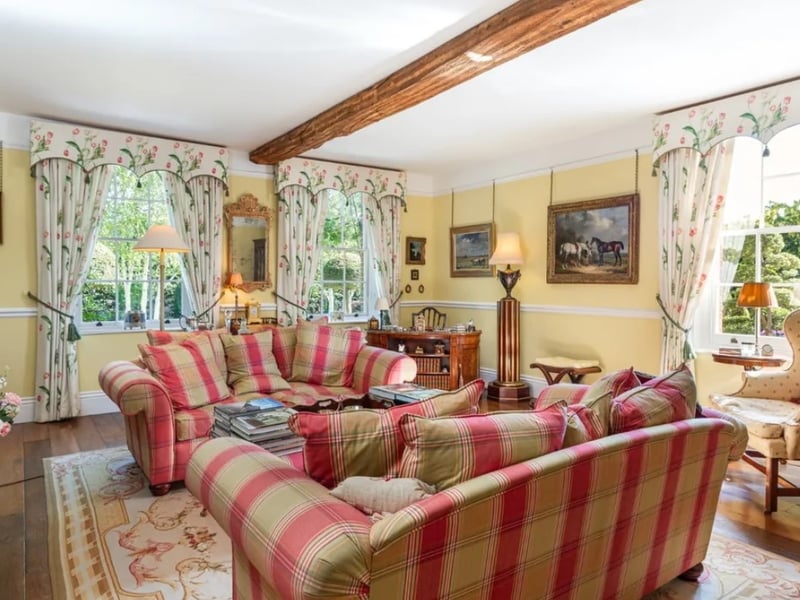 The listing says: "The house has been sympathetically extended and updated over the years to create a modern family home while retaining original features such as oak beams and sash windows." 