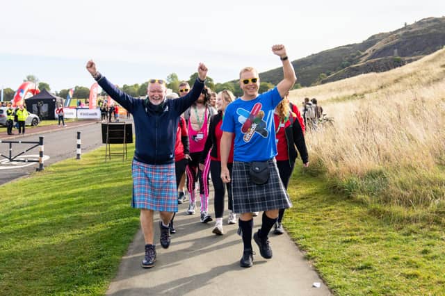 Sir Chris Hoy and Sir Tom Hunter walking with Kiltwalkers in Edinburgh