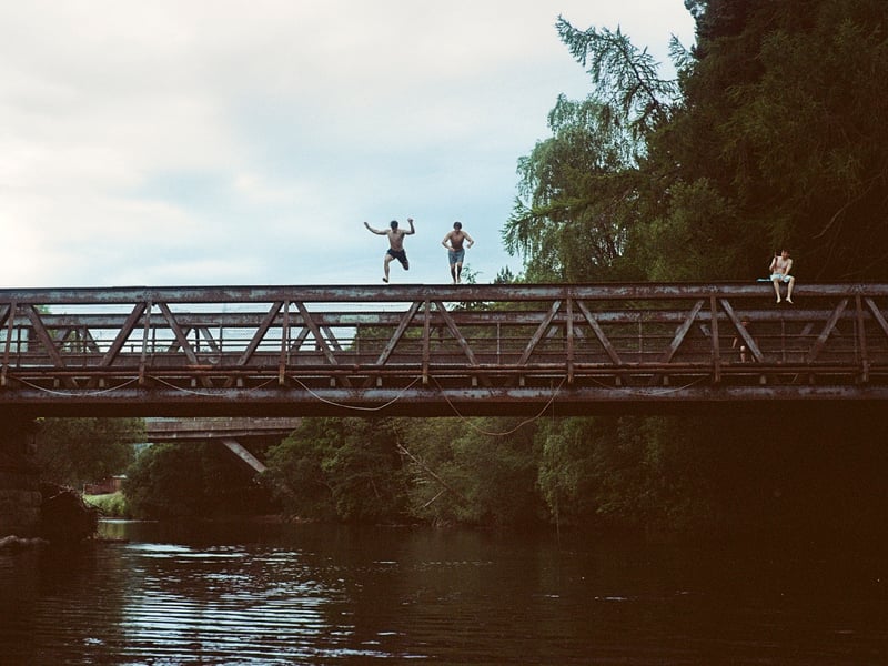 Local to the area and back in Aviemore during university holidays, students partake in the tradition of jumping from the old bridge on a particularly warm summer afternoon during a prolonged dry spell.