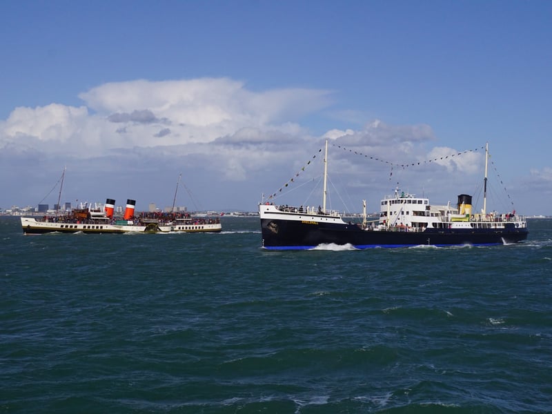 Two historic steamships, SS Shieldhall and PS Waverley, met in the Solent to the delight of passengers.
