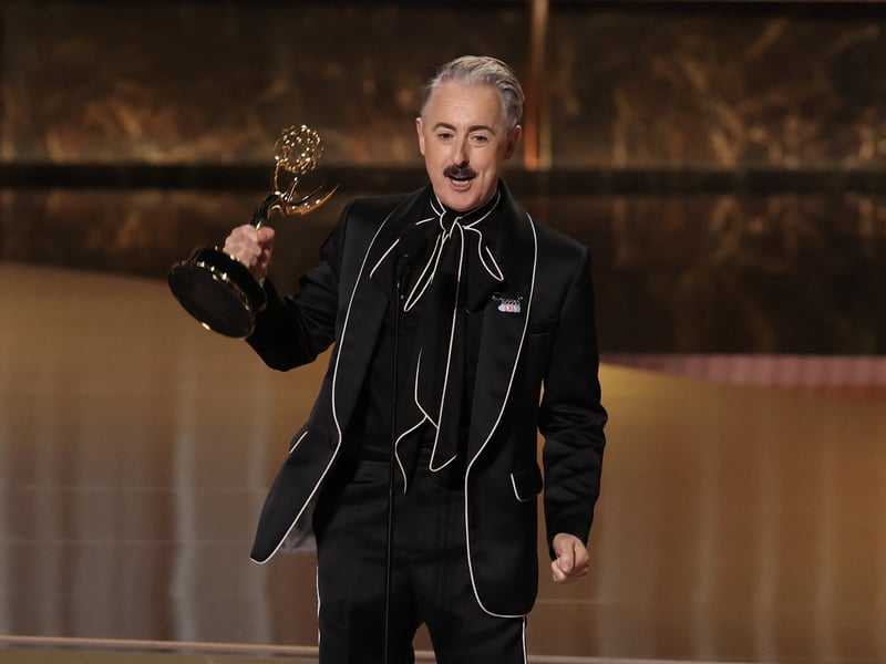 Scottish actor Alan Cumming accepts the award for Outstanding Reality Competition Program for "The Traitors" onstage during the 77th Primetime Emmy Awards.