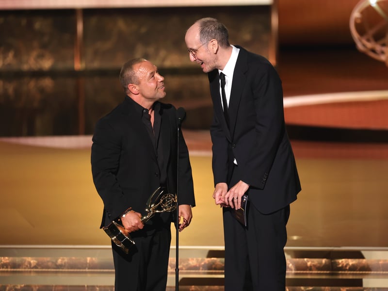 Stephen Graham and Jack Thorne accept the Outstanding Writing for a Limited or Anthology Series or Movie award for "Adolescence" onstage during the 77th Primetime Emmy Awards.
